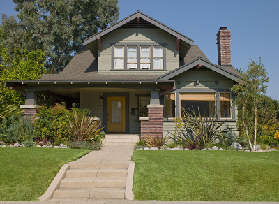 A large house with a front yard.