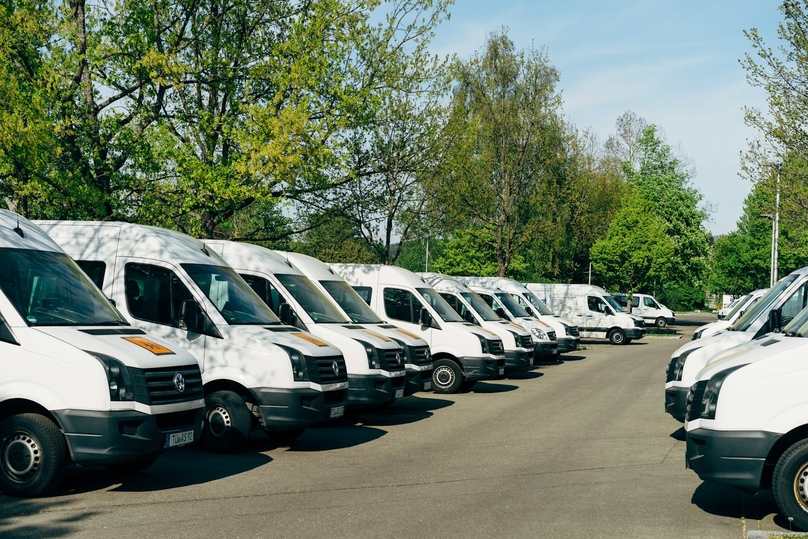 commercial auto cars parked on parking lot during daytime